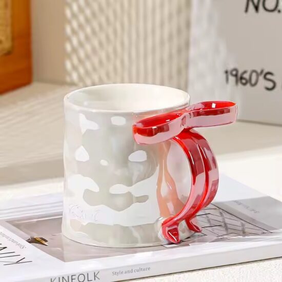 Pearl glaze ceramic mug with creative bowknot design for stylish gifting

