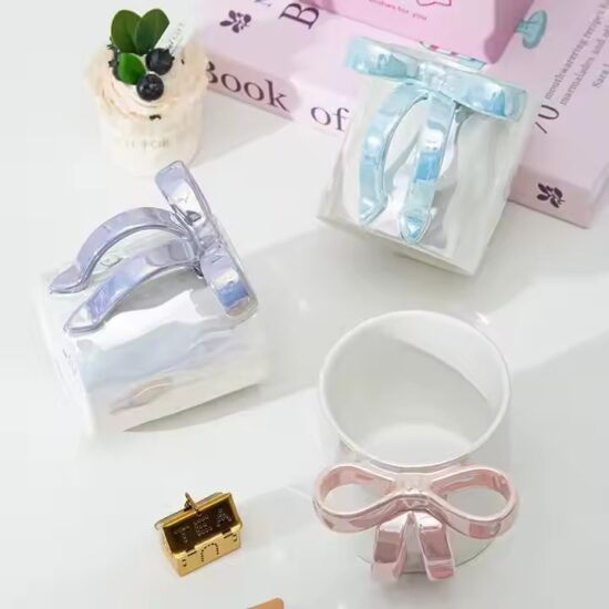 Pearl glaze ceramic mug with creative bowknot design for stylish gifting

