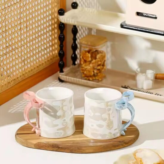 Pearl glaze ceramic mug with creative bowknot design for stylish gifting

