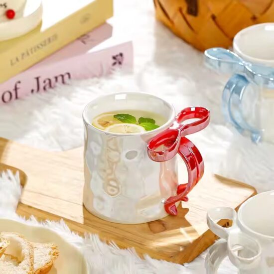 Pearl glaze ceramic mug with creative bowknot design for stylish gifting

