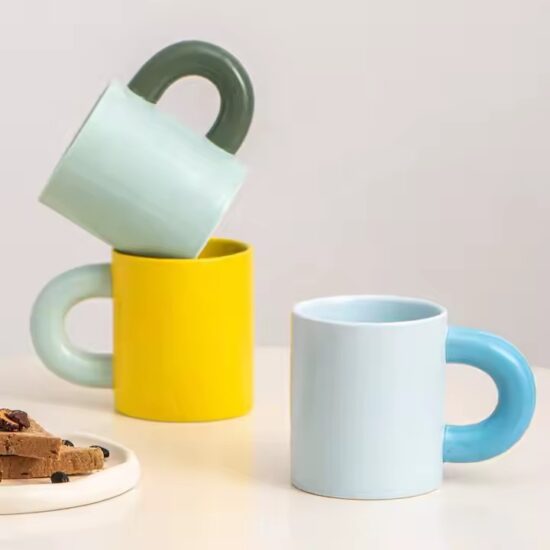 Creative thick-handle ceramic mug in modern design for home or office

