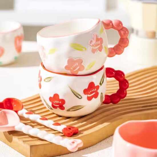 Hand-painted ceramic coffee mug with embossed floral pattern and vintage look