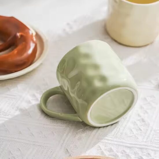 Personalized handmade ceramic coffee mug with artistic glaze and custom design