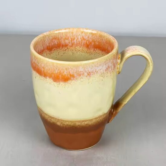 Modern ceramic coffee cup with glossy finish and ergonomic handle design