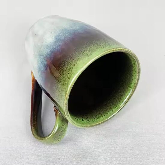 Modern ceramic coffee cup with glossy finish and ergonomic handle design