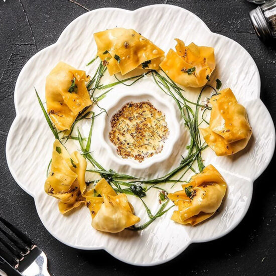 Ceramic dumpling plate with integrated dipping sauce dish for modern dining