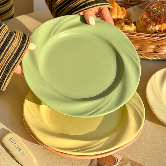 Cream-style ceramic dinner plate with elegant design