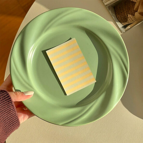 Cream-style ceramic dinner plate with elegant design