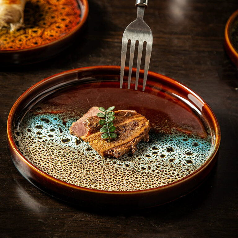 Reactive glaze ceramic dinner plate with handcrafted finish for stylish dining