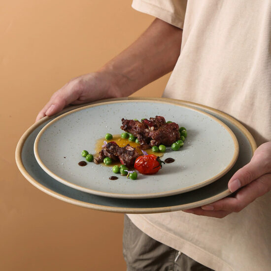 Rustic terracotta ceramic steak plate with vintage round design for restaurants