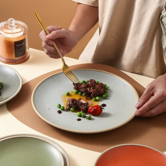 Rustic terracotta ceramic steak plate with vintage round design for restaurants